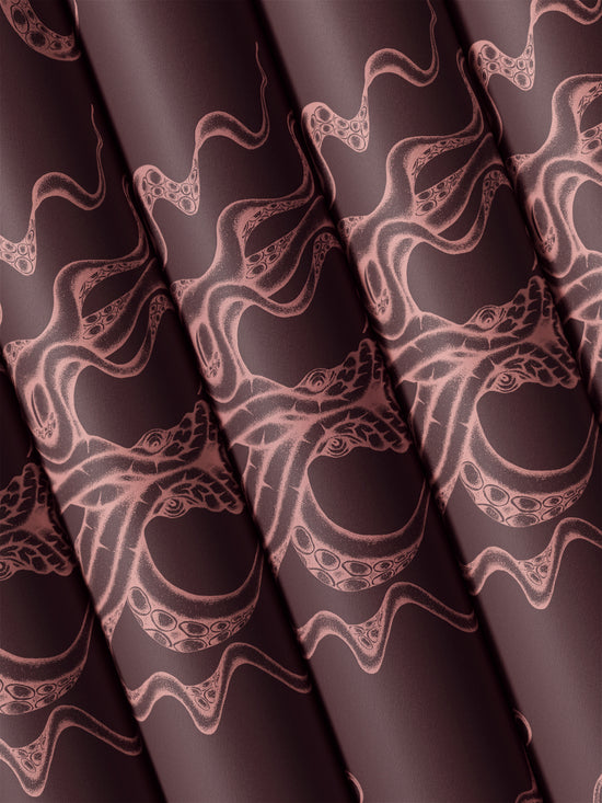 Rolled Kraken Claret wallpaper showing off metallic sheen and pink octopus tentacle design