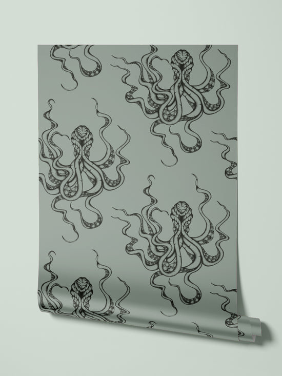 Kraken Steel roll suspended to show hand-drawn octopus print with shimmering grey-green tones.