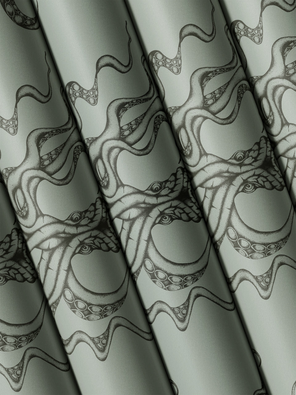 Multiple rolls of Kraken Steel wallpaper folded to reveal moody sea monster print in shimmering tones.