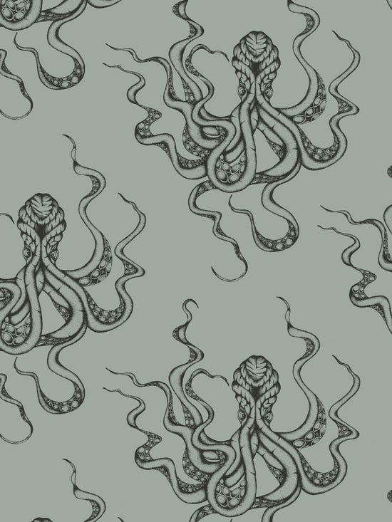 Displayed wall view of Kraken Steel showing hand-inked octopus repeat in sea green-grey with metallic sheen.