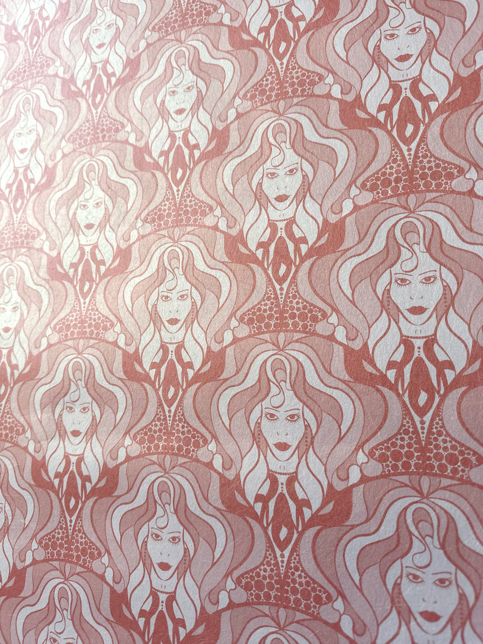 Bold dusky pink repeat pattern wallpaper with vintage glam energy and shimmering warmth.