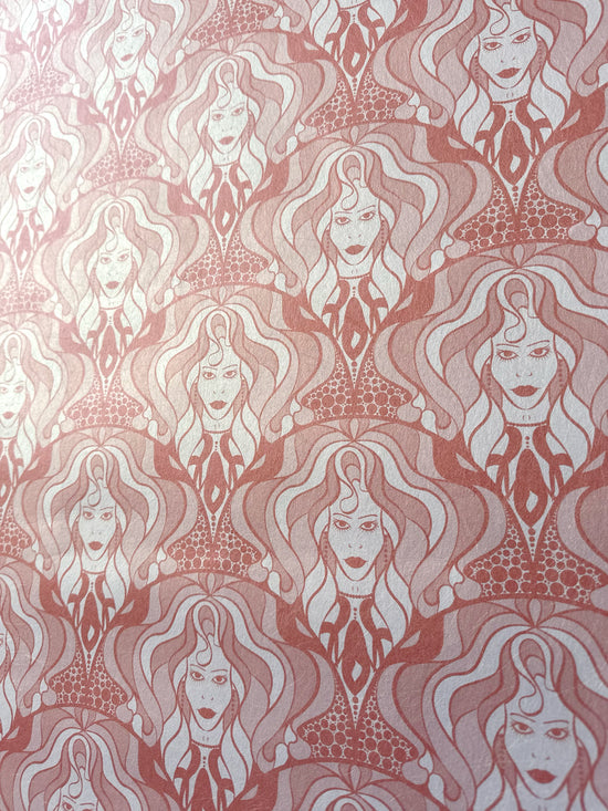 Bold dusky pink repeat pattern wallpaper with vintage glam energy and shimmering warmth.