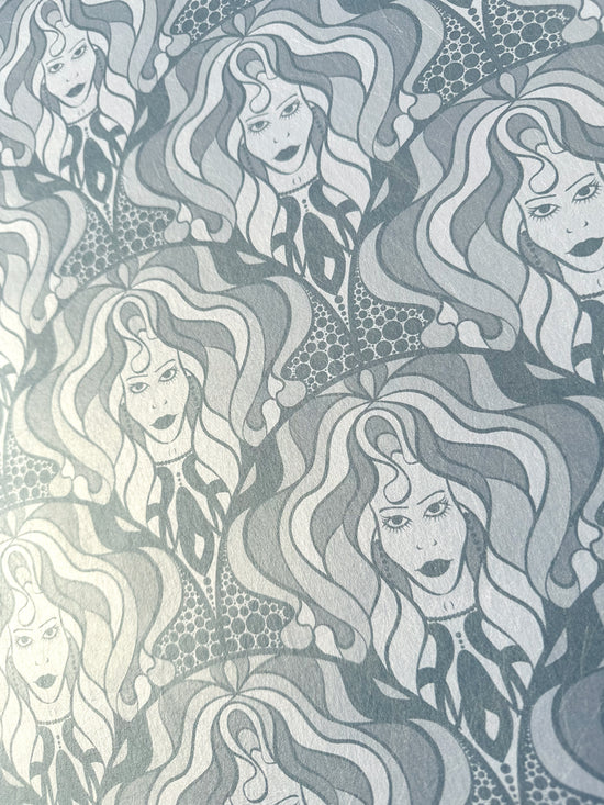 Ash-toned silver wallpaper with gilded 70s diva repeat and maximalist retro flair.