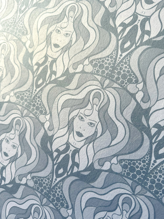 Detailed view of diva-inspired wallpaper with bold, feminine linework and silver shimmer.