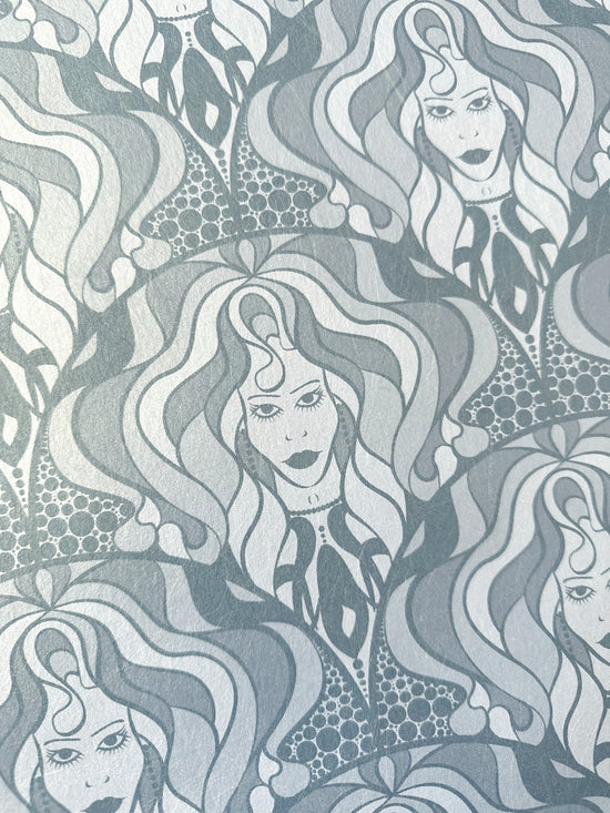 Iridescent wallpaper featuring hand-drawn divas and an Art Nouveau twist in silver tones.