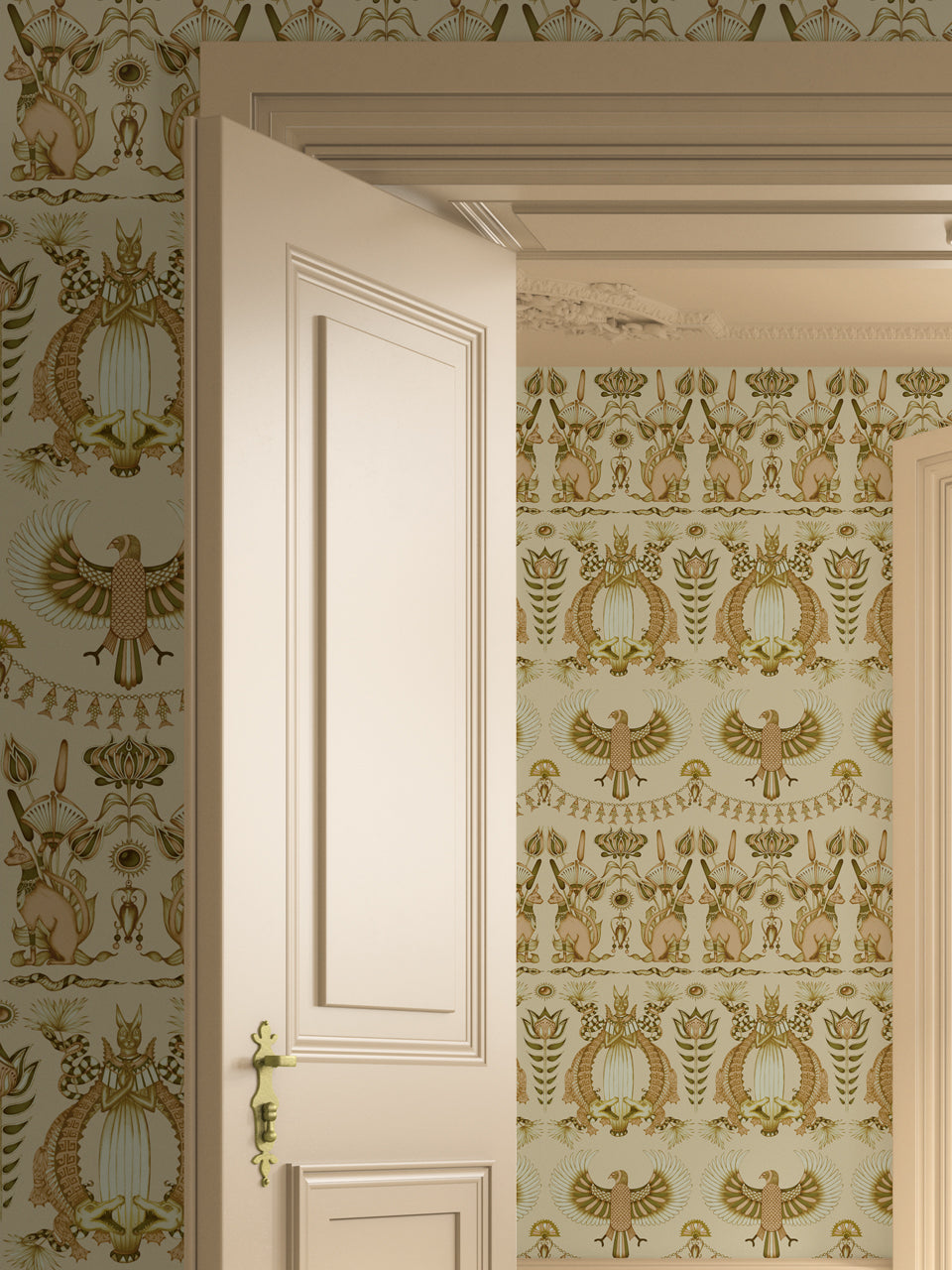 Nefertiti Cream wallpaper styled in a bedroom with soft peach and gold jungle animal print.