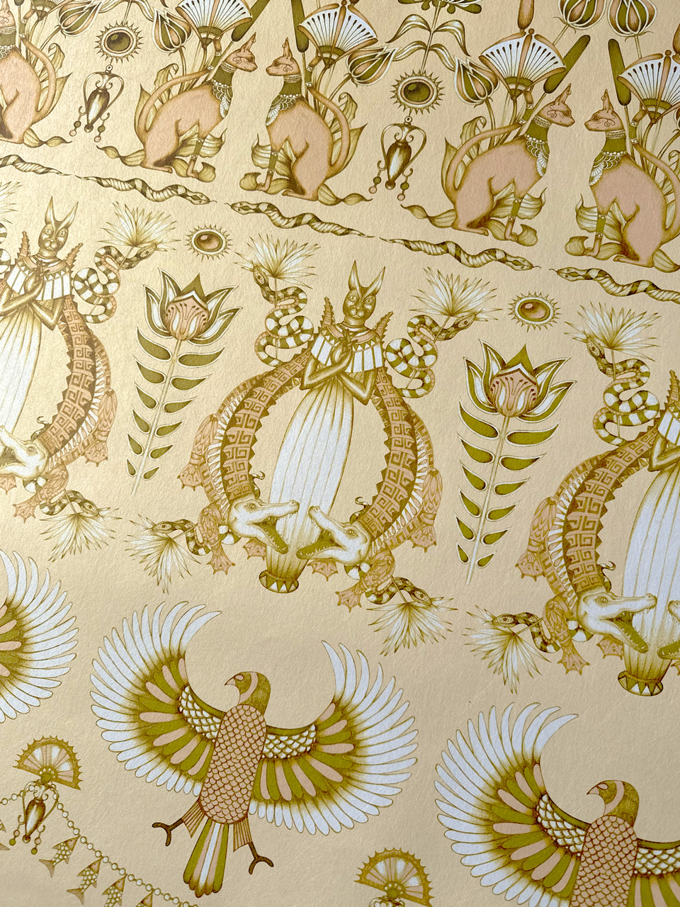 Jewelled motif detail on the floral Egyptian-inspired Nefertiti Cream wallpaper in luxe tones.