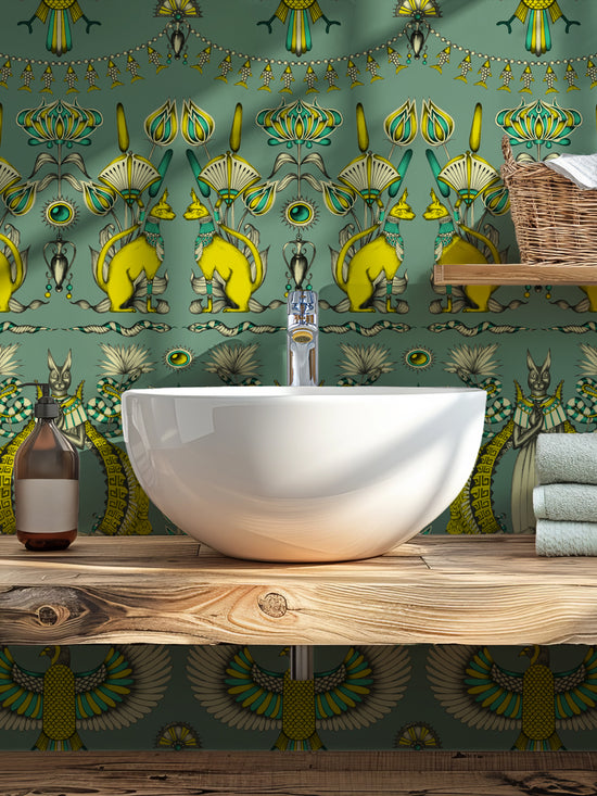 Feature wall in guest bathroom with luxurious Nefertiti wallpaper in gold, ivory, and eucalyptus tones.