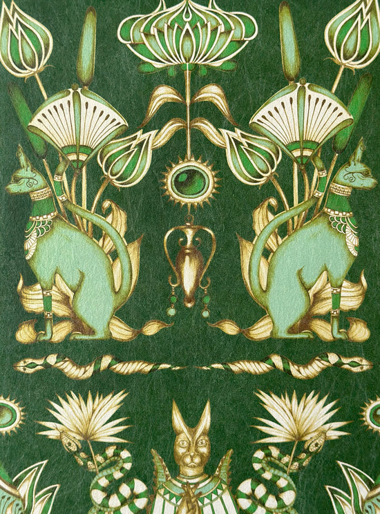 Metallic gold detailing on Nefertiti Green wallpaper with Egyptian cats and snakes in emerald tones.