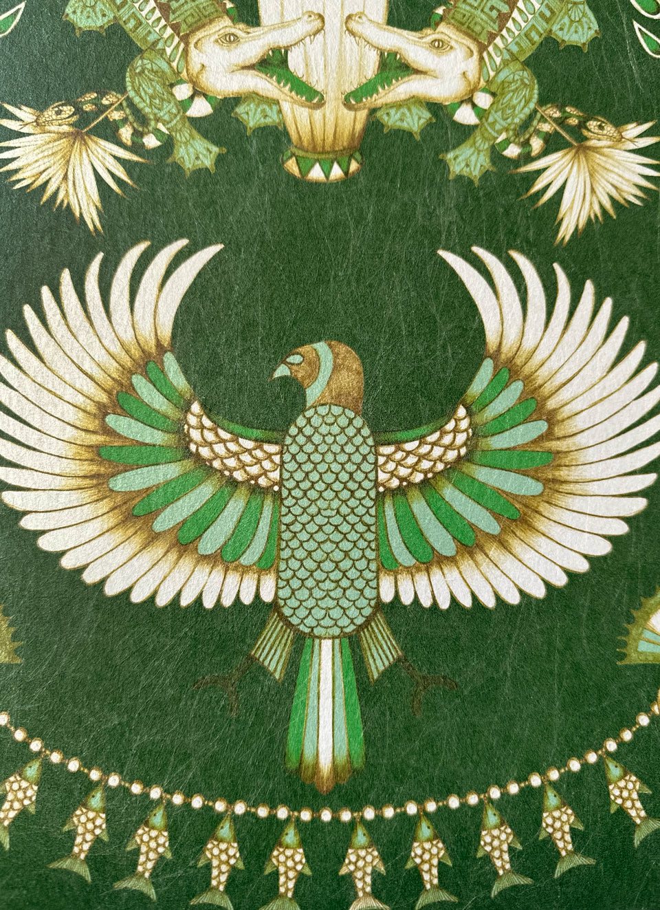 Bird and fish details on Nefertiti Green wallpaper—perfect for maximalist Egyptian style decor.