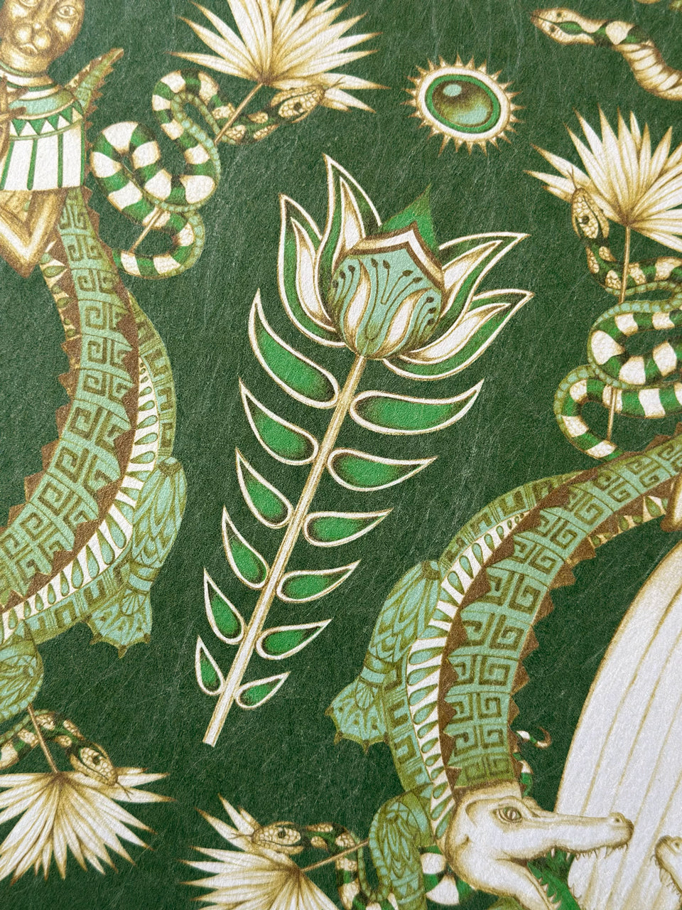 Mint green and gold floral detail on Nefertiti Green wallpaper designed for luxe interiors.