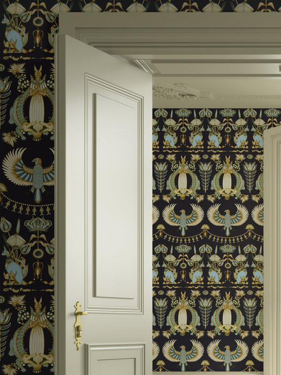 Nefertiti Navy wallpaper in a bedroom with midnight blue and duck egg Egyptian motifs.