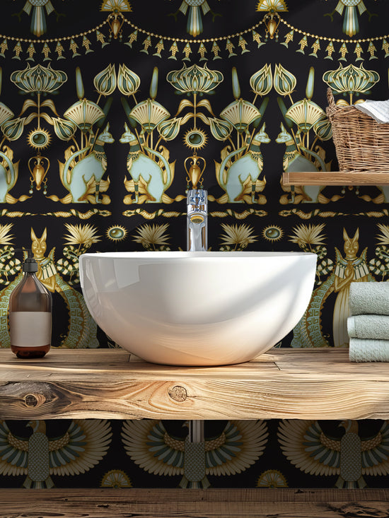 Cloakroom styled with Nefertiti Navy wallpaper featuring gold sacred cats and birds.