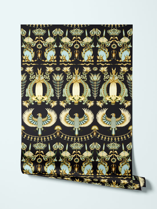 Rolled view of Nefertiti Navy wallpaper showing Egyptian animal and botanical print on gold parchment.