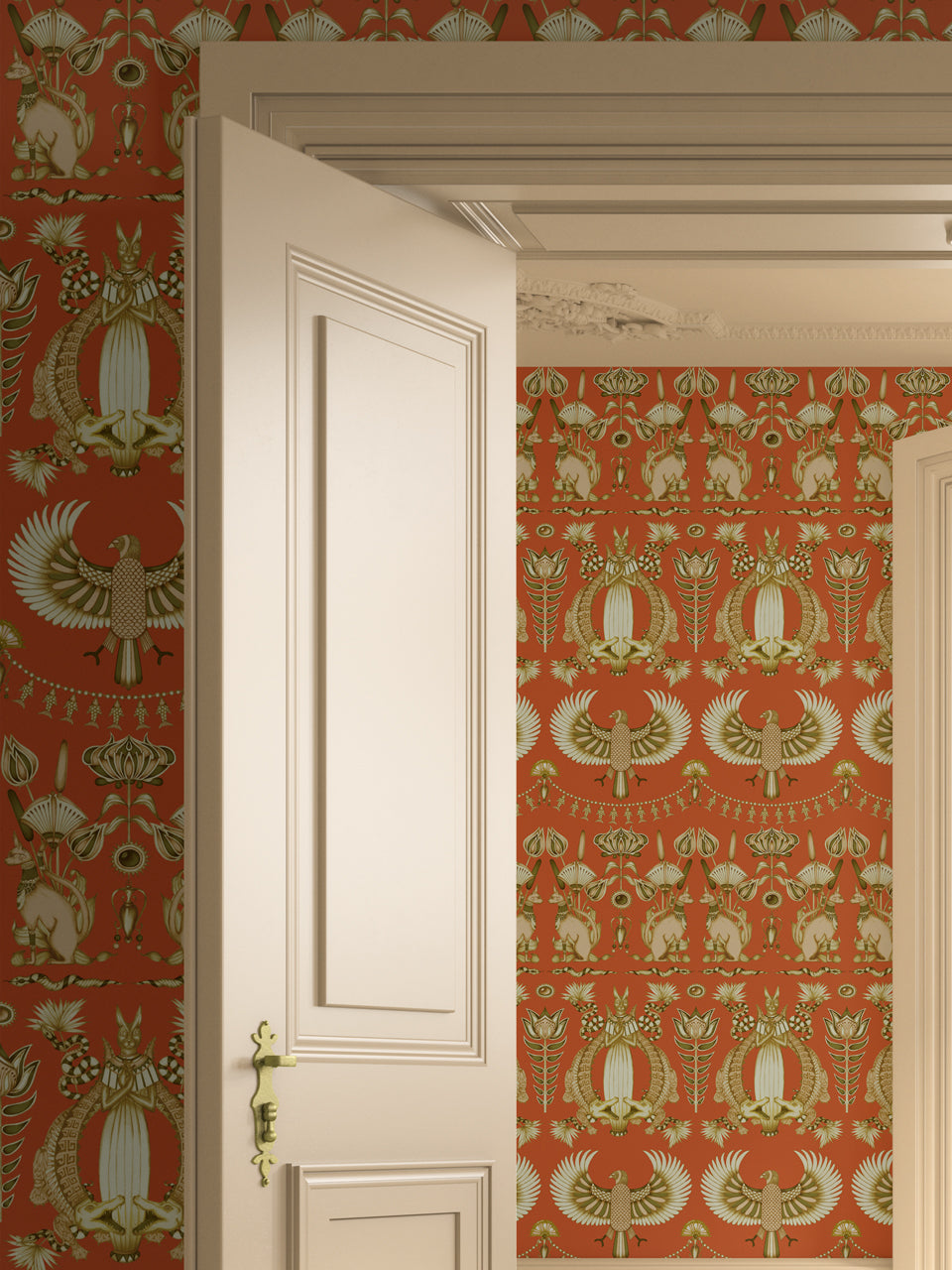 Nefertiti Orange wallpaper in a warm, bohemian bedroom with bold ancient Egyptian illustrations.