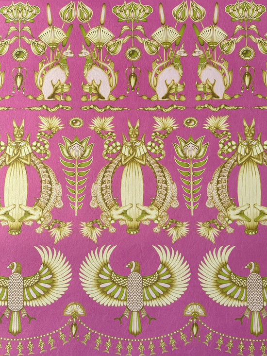 Close-up of Egyptian cats and papyrus motifs on Nefertiti Pink wallpaper with champagne gold detail.