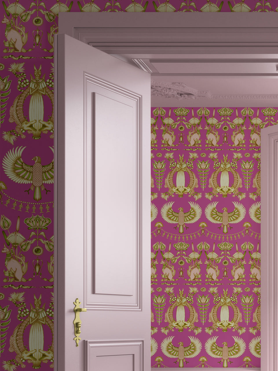 Bold designer bedroom featuring Egyptian Revival-style Nefertiti Pink wallpaper in vibrant pink and gold.