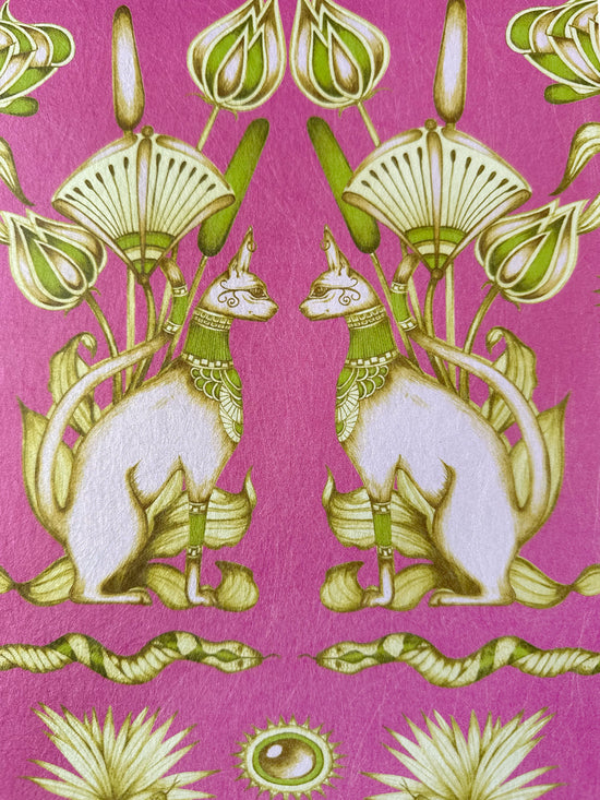 Fuchsia wallpaper featuring Egyptian cats, snakes and papyrus flowers with shimmering gold accents.