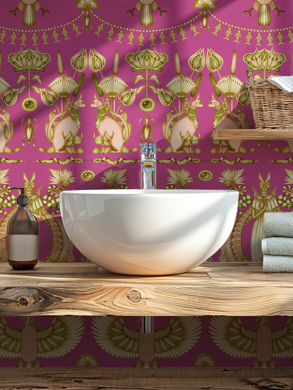 Glamorous cloakroom styled with Nefertiti Pink wallpaper and maximalist art deco motifs.