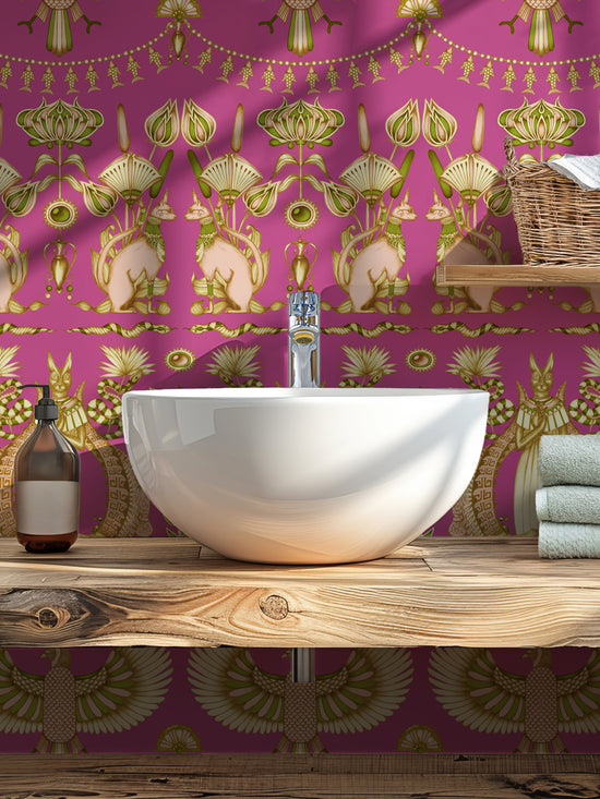 Glamorous cloakroom styled with Nefertiti Pink wallpaper and maximalist art deco motifs.