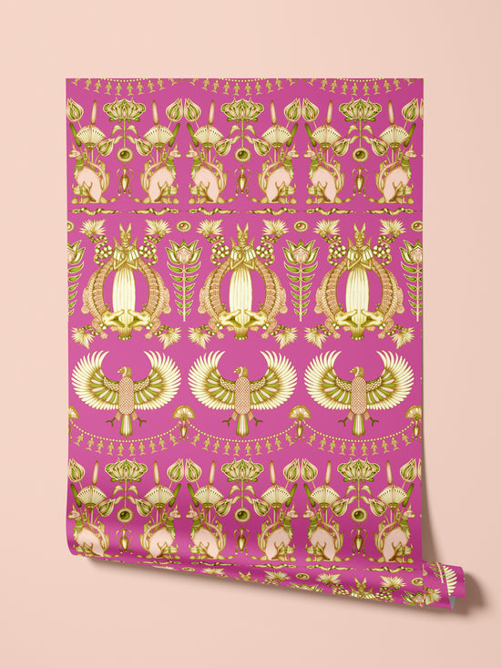 Rolled wallpaper sample showing shimmering gold parchment-style finish of Nefertiti Pink wallpaper.