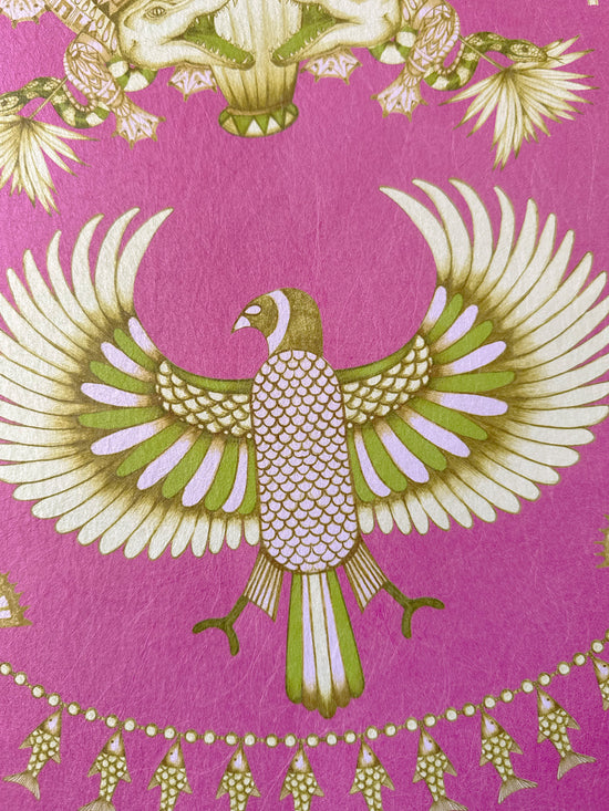 Intricate winged birds and fish motifs in gold lustre on bold fuchsia Nefertiti Pink wallpaper.