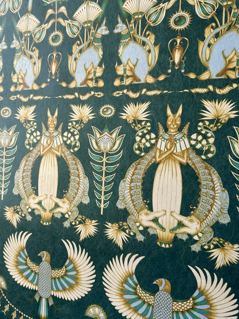 Ancient Egyptian floral and animal detailing in duck egg and gold lustre tones.