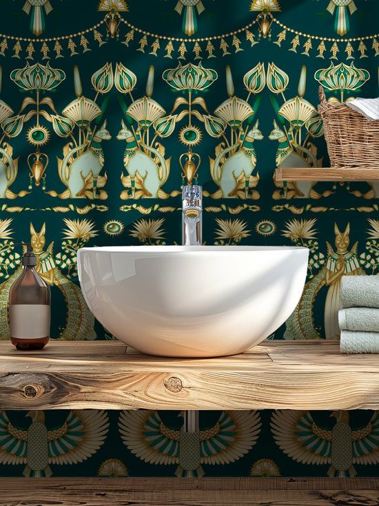 Bohemian glam cloakroom styled with gold Egyptian wallpaper and heritage motifs.