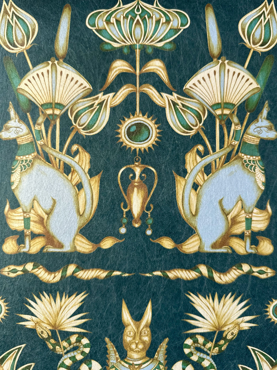 Egyptian cats and coiled snakes illustrated in duck egg with shimmering metallic finish.