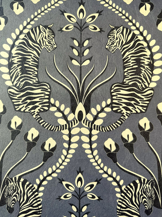 Cream gold folk-inspired detail with tiger and florals on Secret Garden Safari Black wallpaper.