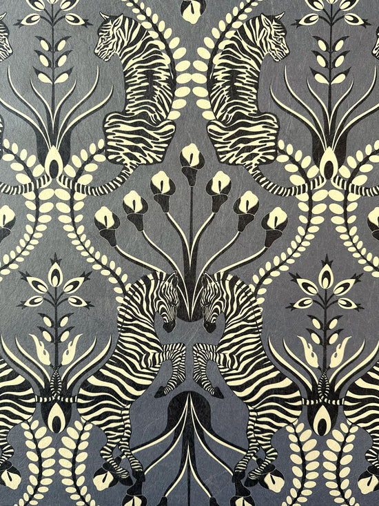 Opulent black wallpaper close-up showing zebra, tiger, and velvet black floral accents from Secret Garden Safari.