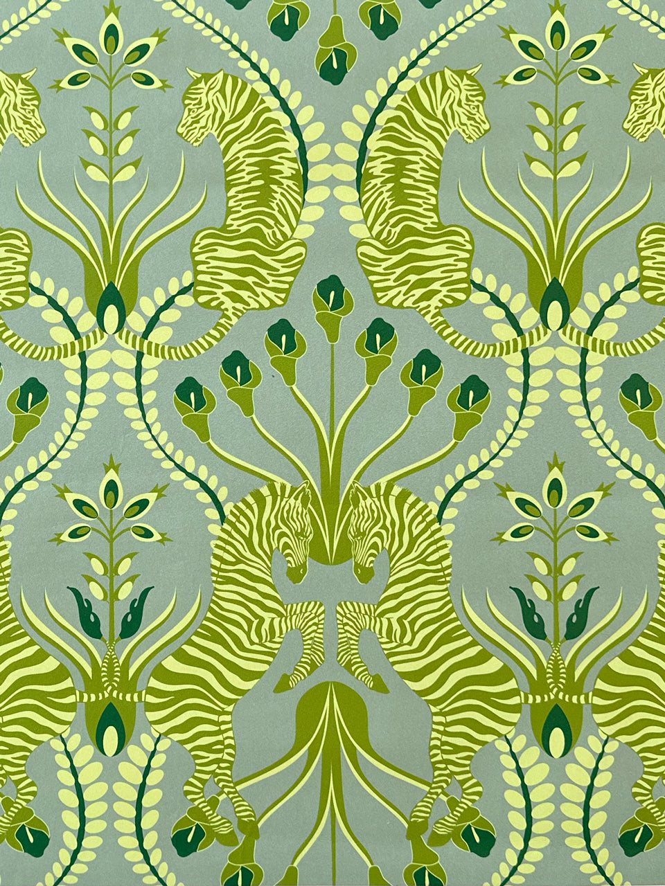Detailed zebra print from Secret Garden Safari Green wallpaper featuring moss and olive foliage in a maximalist floral style.