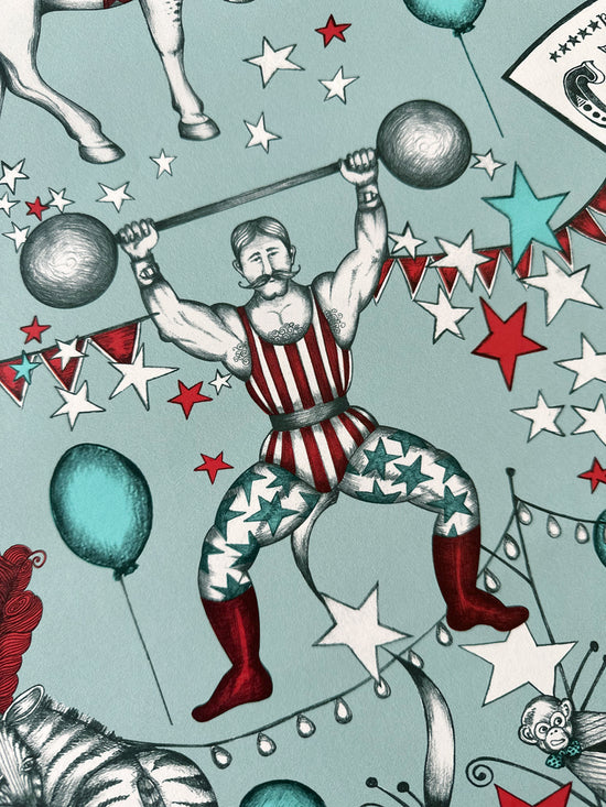 Vintage-style illustration of a strongman performer with circus elements on a duck egg blue background.