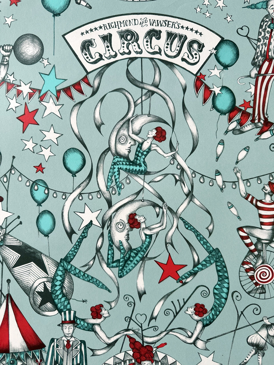 Wallpaper circus scene with performers and balloons with turquoise and dusty duck egg background.