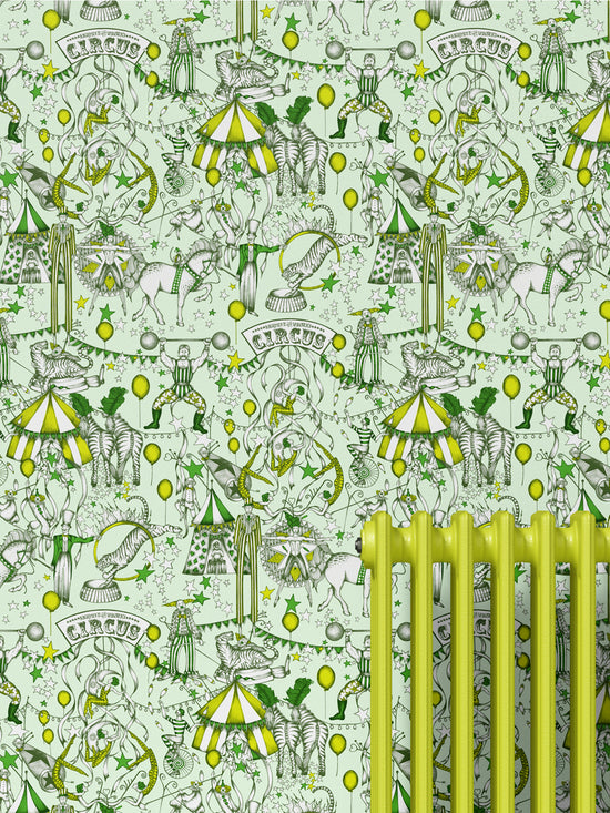 Room scene with yellow radiator and The Greatest Show Citrus wallpaper in a playful circus-inspired style.