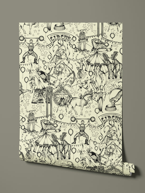 Hanging wallpaper roll showing full repeat of hand-drawn vintage circus design in monochrome.