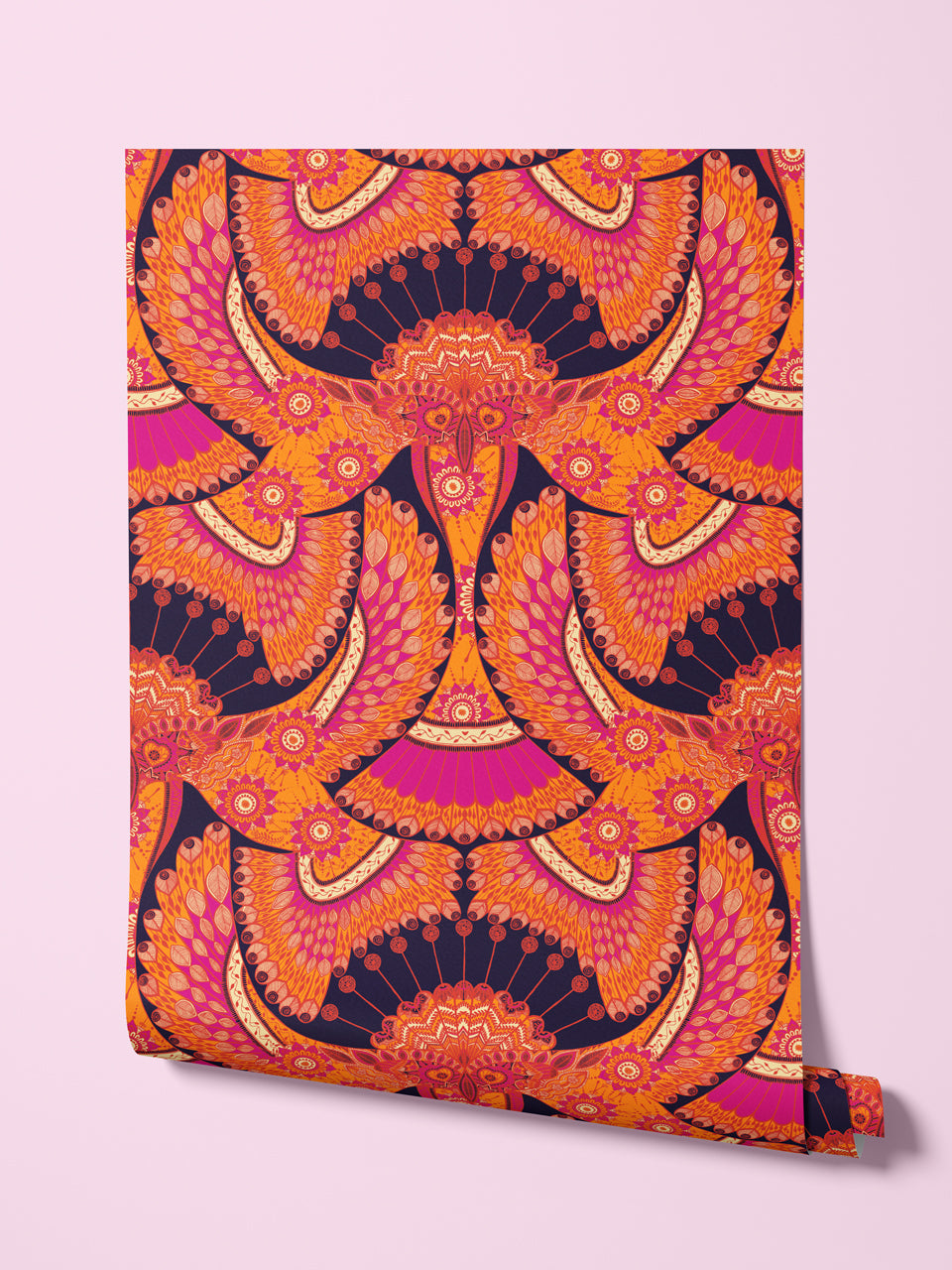 Rolled sample of Indian-inspired wallpaper with bold tropical birds in coral red, hot pink and warm aubergine.